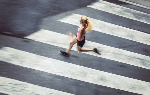 istock Female Athlete Runnin in Urban Environment, Blurred motion 1014712804