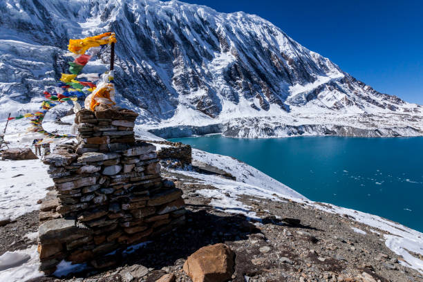 Stone stupa with prayer flags near Tilicho lake. Nepal, Himalaya mountains, Annapurna Conservation Area Stone stupa with prayer flags near Tilicho lake. Nepal, Himalaya mountains, Annapurna Conservation Area annapurna conservation area photos stock pictures, royalty-free photos & images