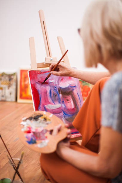 istock Woman painting 1014715866