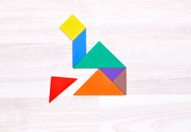 istock Colorful tangram puzzle in rocket shape 1014716740