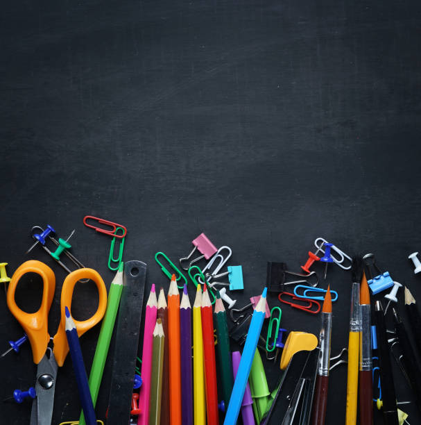 istock School Stationary on Blackboard Copy Space Top View 1014721710