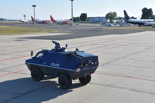 Berlin ,Germany: July 26, 2018 : Berlin Schönefeld Airport , The picture shows Armored security vehicle at the airport in Germany, Berlin. \nBerlin Schönefeld Airport Is Berlin's second largest international airport after Berlin Tegel Airport. It is located 18 km southeast of Berlin, near the town of Schönfeld