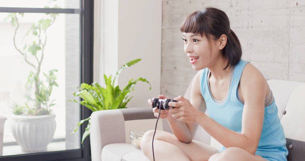 istock woman play video game 1014729928