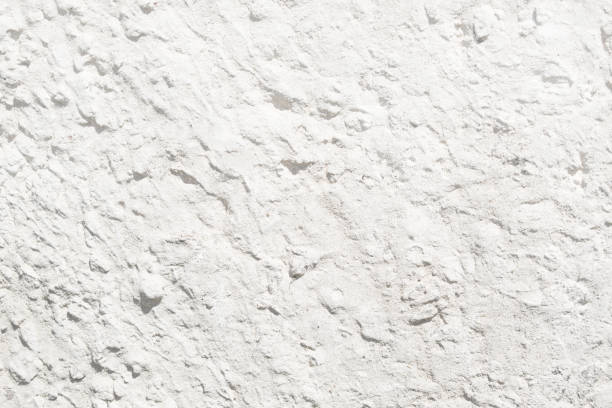 istock White stucco textured wall. Abstract texture of stucco. White cement plaster background. 1014730462