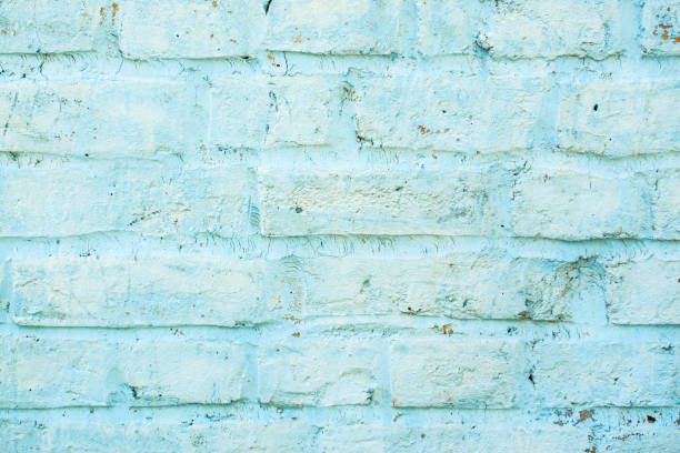 istock Blue old brick wall with paint, vintage pastel background texture close up 1014732762