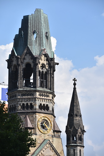 Close-up of church tower with clock face of protestant church at the old town of Swiss City of Winterthur on a cloudy spring day. Photo taken May 17th, 2023, Winterthur, Switzerland.