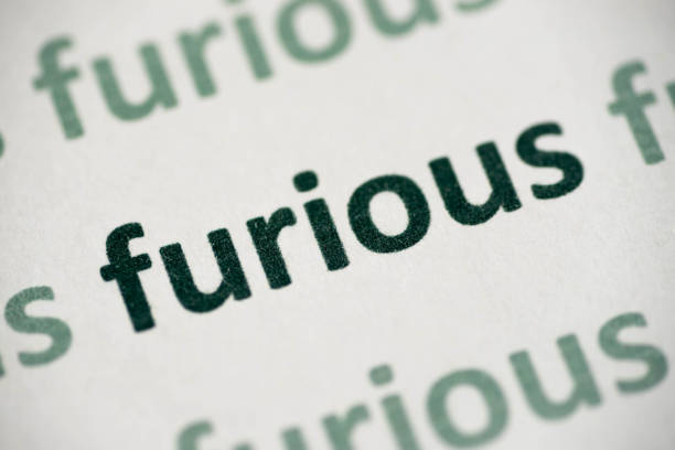 istock word furious printed on paper macro 1014737496