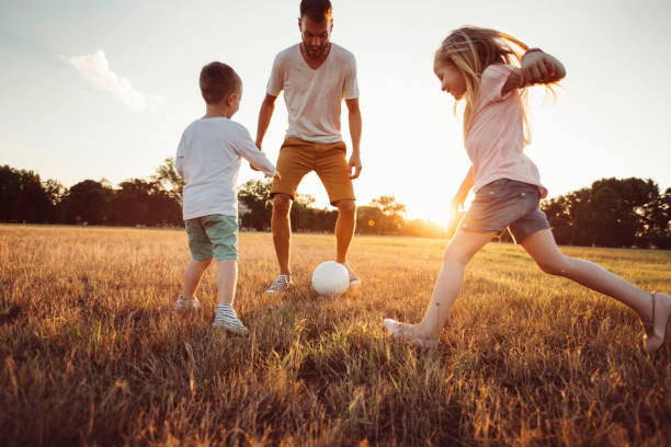 istock Father and kids playing 1014754454
