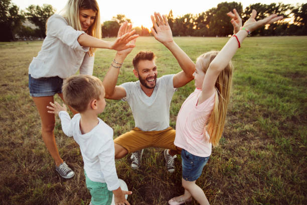 istock Parents giggling with kids 1014754800