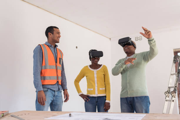 istock Young architect using VR to show African couple their new home 1014757904