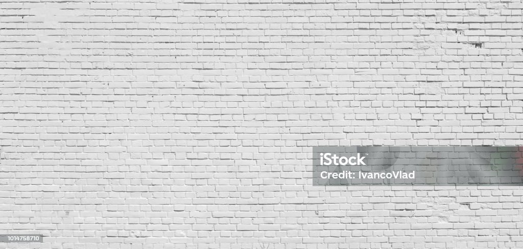Brick wall painted with white paint. Background. Brick wall painted with white paint. Brick Wall Stock Photo