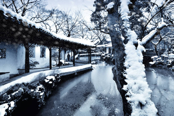 istock China Garden at Snowing Sky, Suzhou, China 1014763472