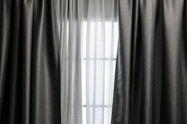 istock Curtain at window in the living room 1014764274