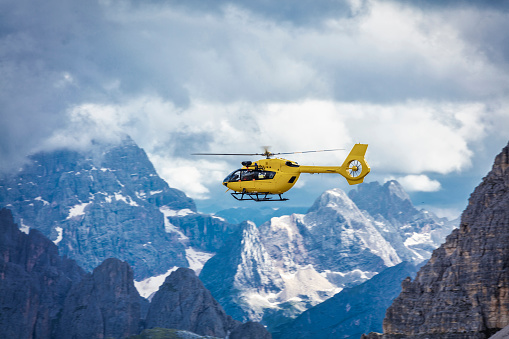 Panoramic flight over the mountains. Air transport. Helicopter flight over the epic landscape. Rescue mission in the wilderness.