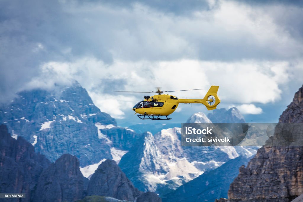 Panoramic flight over the mountains. Air transport. Panoramic flight over the mountains. Air transport. Helicopter flight over the epic landscape. Rescue mission in the wilderness. Helicopter Stock Photo
