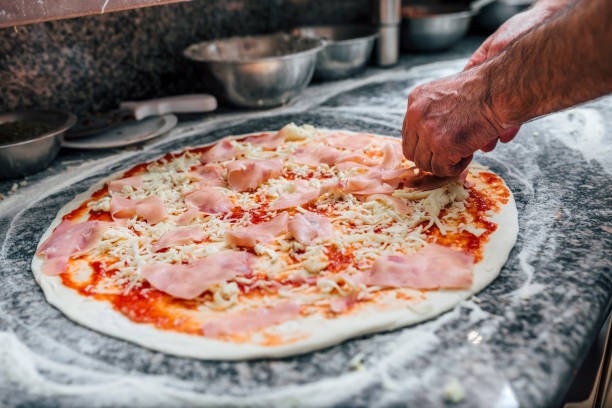 istock Close-up image of chef making pizza. 1014771244