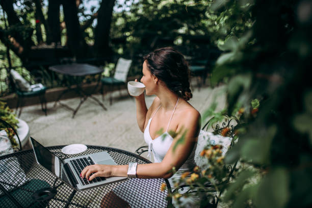 istock Relaxing with a cup of coffee in outdoors cafe. 1014773694