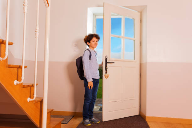 istock Preteen boy coming back home from school 1014778414