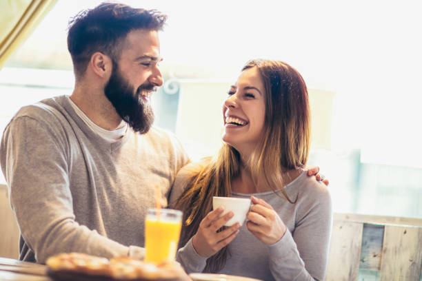 istock Smiling couple enjoying in pizza, having fun together. 1014792624