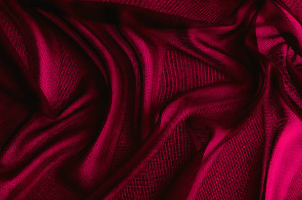 istock Texture, background, pattern. Red transparent fabric. Organza Silk Fabric Hand Dyed Madder Pale orange rust Red tangerine transparent natural plant 1014796512