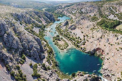 Zrmanja River in northern Dalmatia, Croatia is famous for its crystal clear waters and countless waterfalls surrounded by a deep canyon.