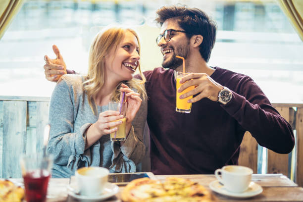 istock Smiling couple enjoying in pizza, having fun together. 1014801850