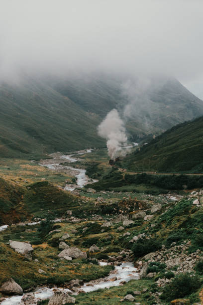 Scenic view of steam locomotive in Furka Pass, Switzerland
