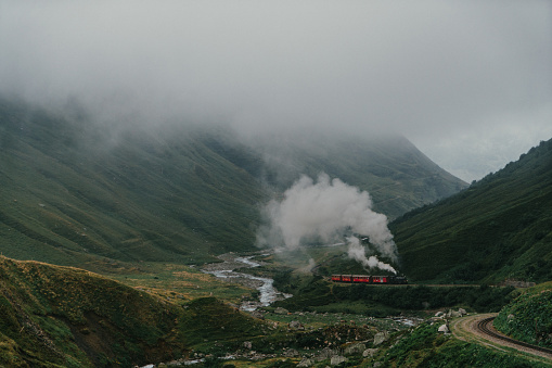 Scenic view of steam locomotive in Furka Pass, Switzerland