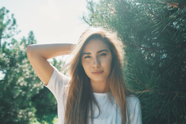 istock Close-up young woman with beautiful face features enjoying sun 1014807272