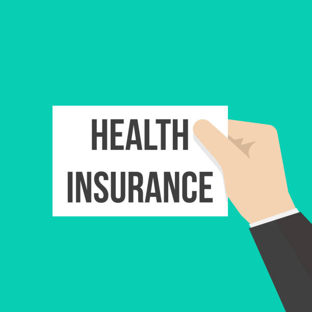 istock Man showing paper HEALTH INSURANCE text 1014811010