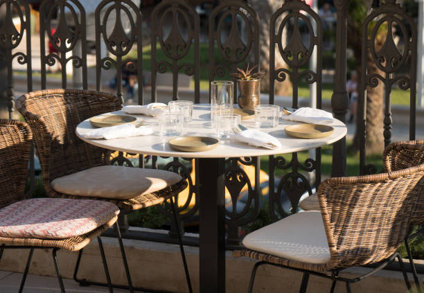 istock Served table for four persons in restaurant at summer. 1014813616