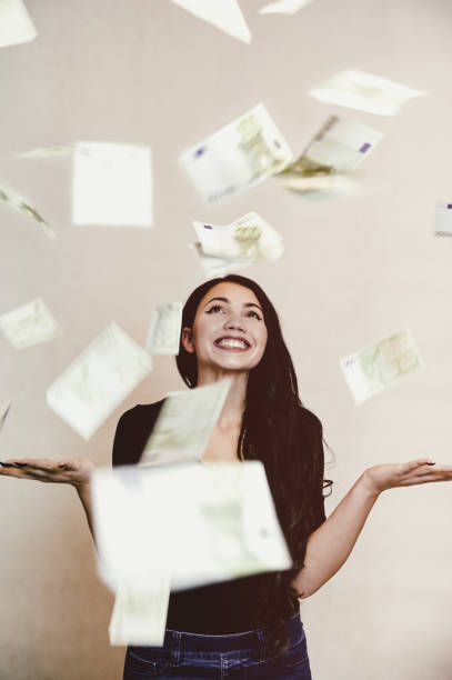 istock Falling euros and happy girl 1014814732