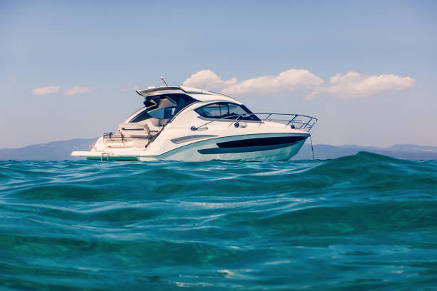 istock Motor boat floating on clear turquoise water 1014818452