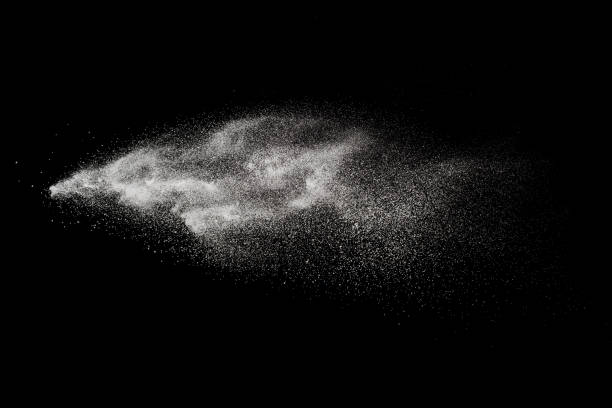 istock Throwing white particle splash on background. Bizarre forms of of white powder explode on cloud against colorful background. 1014822274