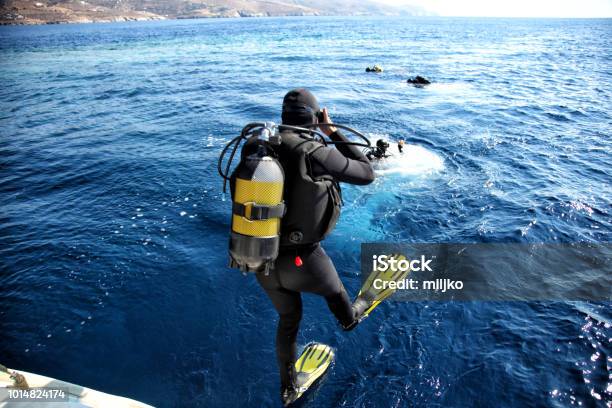 Divers Jumping From The Boat In Water Stock Photo - Download Image Now - Scuba Diving, Diving Into Water, Underwater Diving