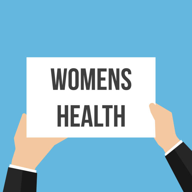 istock Man showing paper WOMENS HEALTH text 1014827618