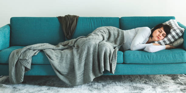 istock Woman sleeping on the sofa 1014831698