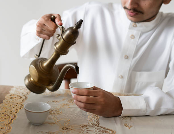 istock Muslim man having a cup of tea 1014834364