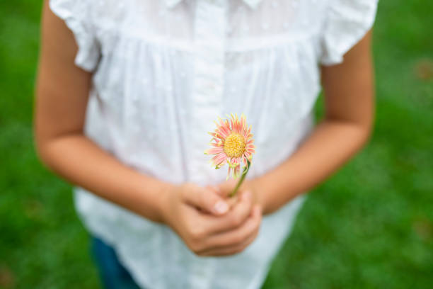 istock Girl with flower 1014834454