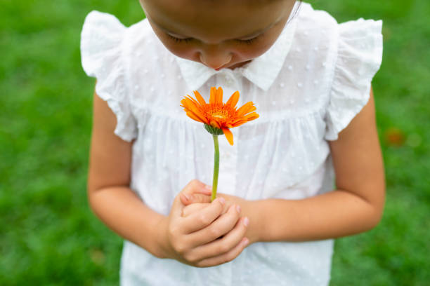 istock Girl with flower 1014834478