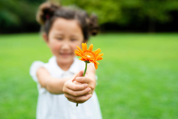istock Girl with flower 1014834506