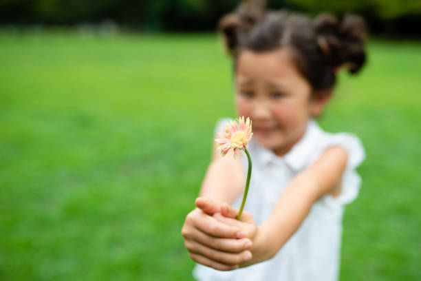 istock Girl with flower 1014834518