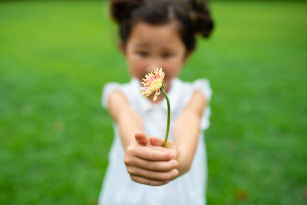 istock Girl with flower 1014834544