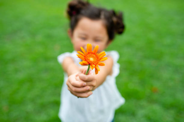 istock Girl with flower 1014834556