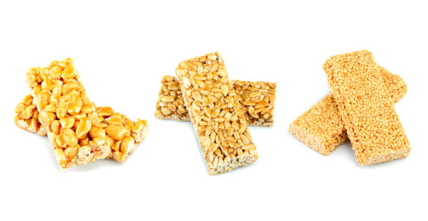 istock Sunflower seeds, sesame seeds, peanuts in caramel. 1014834622
