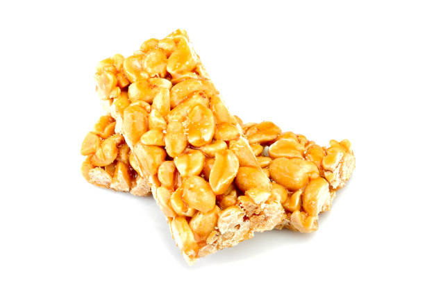 istock Peeled peanuts in caramel.Candy bar natural. 1014834828