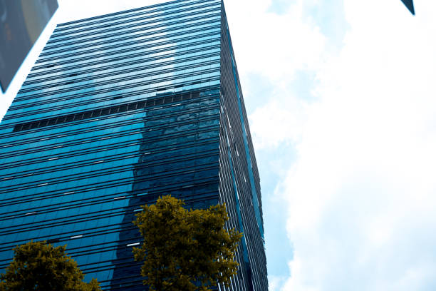 istock Bottom up view of Modern office building in Shenzhen, China 1014848244