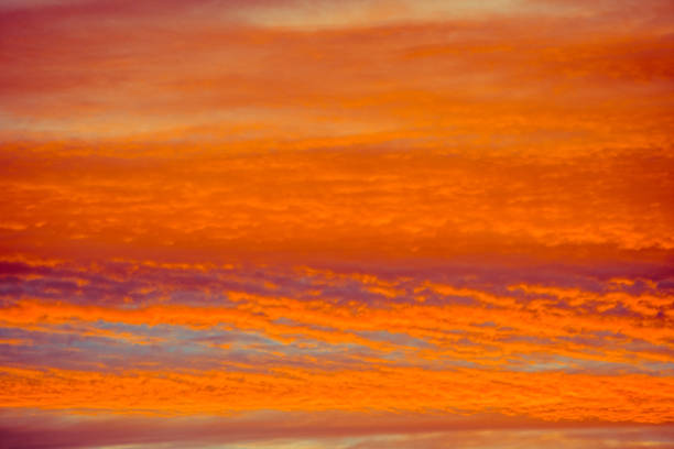 istock blue and orange sky clouds at sunset or sunrise. 1014848544