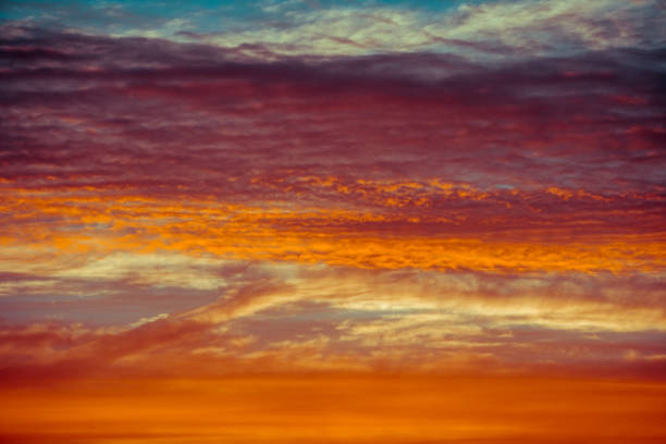 istock blue and orange sky clouds at sunset or sunrise. 1014851250