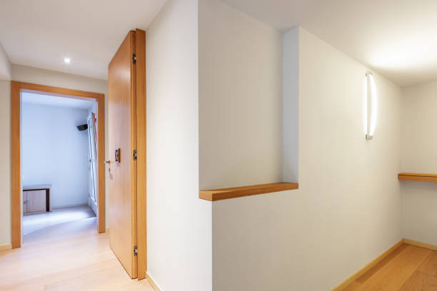 istock Fully white corridor with parquet in modern apartment 1014851874